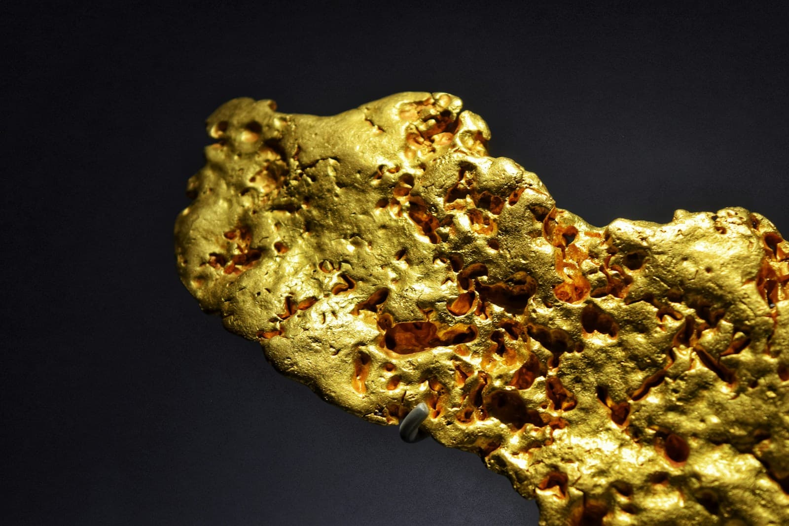 The rough surface of a natural gold nugget